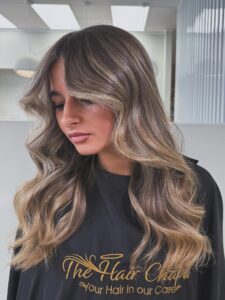 Soft lived-in blonde hair created using balayage and foil techniques